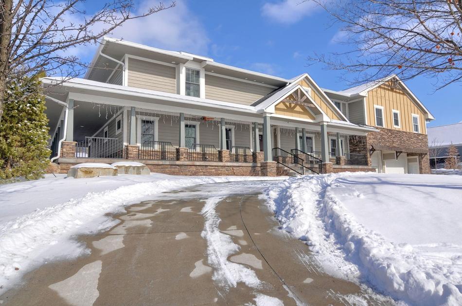 Dream home: Oakland Township home features two-story stone fireplace and wrap-around porch bit.ly/38ewAYV