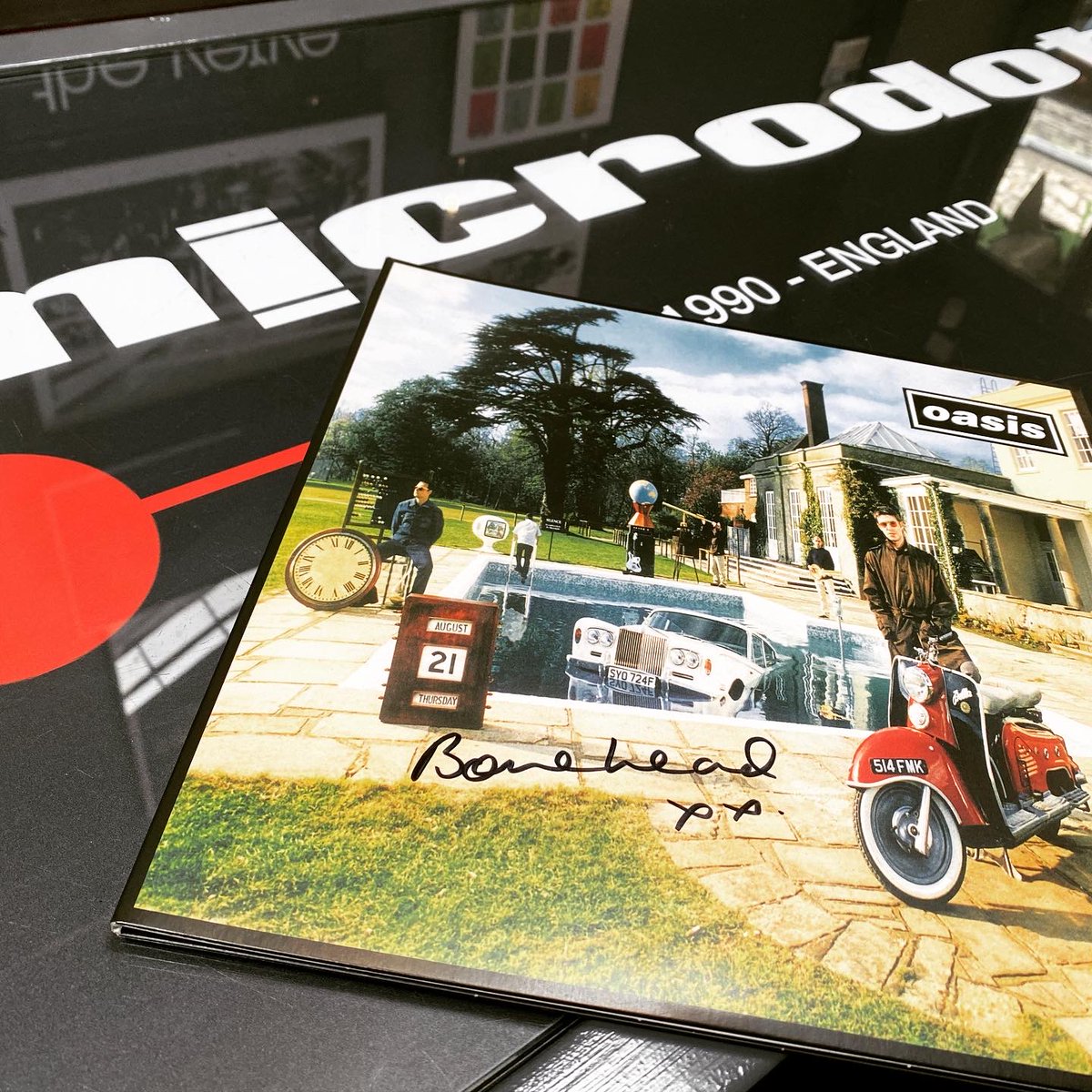 Competition - win a vinyl copy of #Oasis ‘Be Here Now’ signed by @boneheadspage. To enter follow us @microdotcreativ - tag two friends &amp; retweet. Bonehead here in the Microdot Boutique signing the record. Third in the series of his prints to be released on Friday the 26th March.
