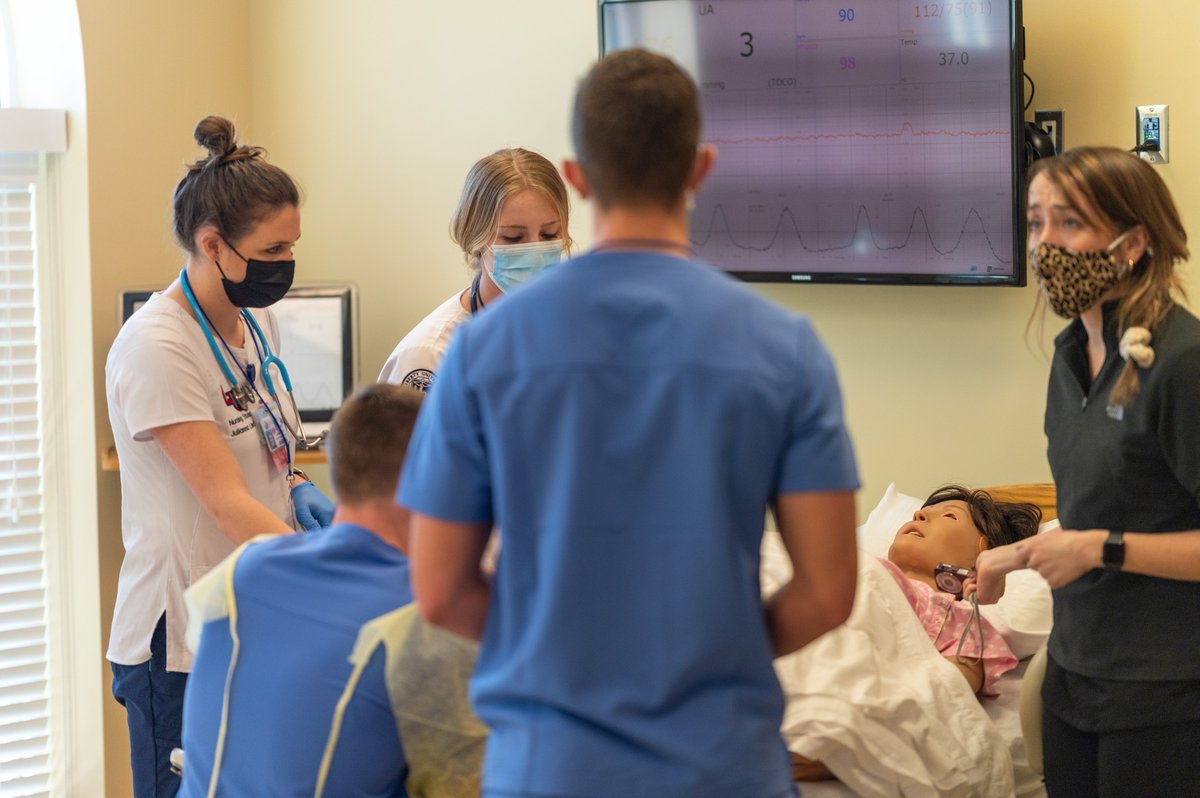 LibertyMedicine's tweet photo. @LibertyU student nurses and doctors hone their communication and leadership skills during simulated birth and delivery experiences for interprofessional education on March 3. Images by @cbreedlovephoto. #LUCOM #LUSON https://t.co/fCJukH75dC