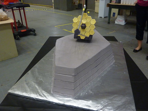 A 5-layer gray cake with the James Webb Space Telescope primary mirror on top, made by the family of a Crew and Thermal Systems Division engineer for a NASA Johnson Webb-related milestone. Photo: JSC/Trish Petete