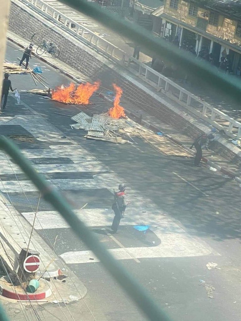 Photos shows that police burns the bamboo shelters which prevent soldiers and police entering their streets on the Bargayar Road, Yangon. #WhatsHappeningInMyanmar