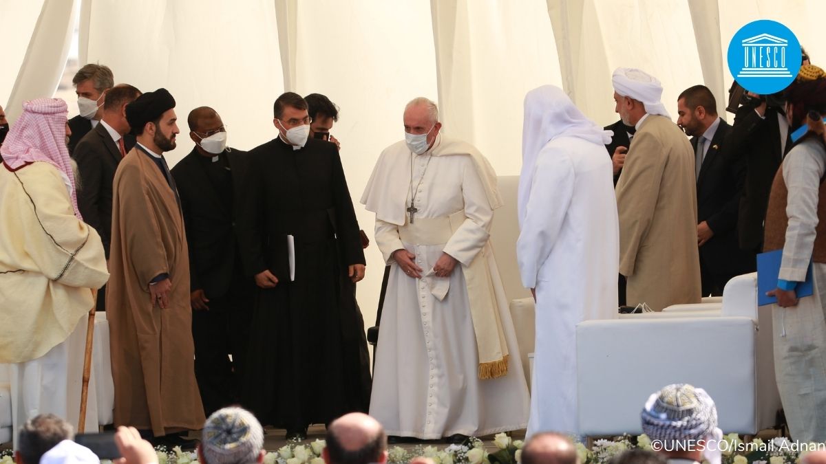 UNESCO's tweet photo. The land of #Iraq sits proudly in our collective history. The Mesopotamian city of Ur was a major religious, political &amp; urban centre, and saw the origin of writing and monumental architecture.
 
Here, today, @Pontifex holds an inter-religious prayer service.

#PopeFrancisinIraq https://t.co/Q4MUTUxtia