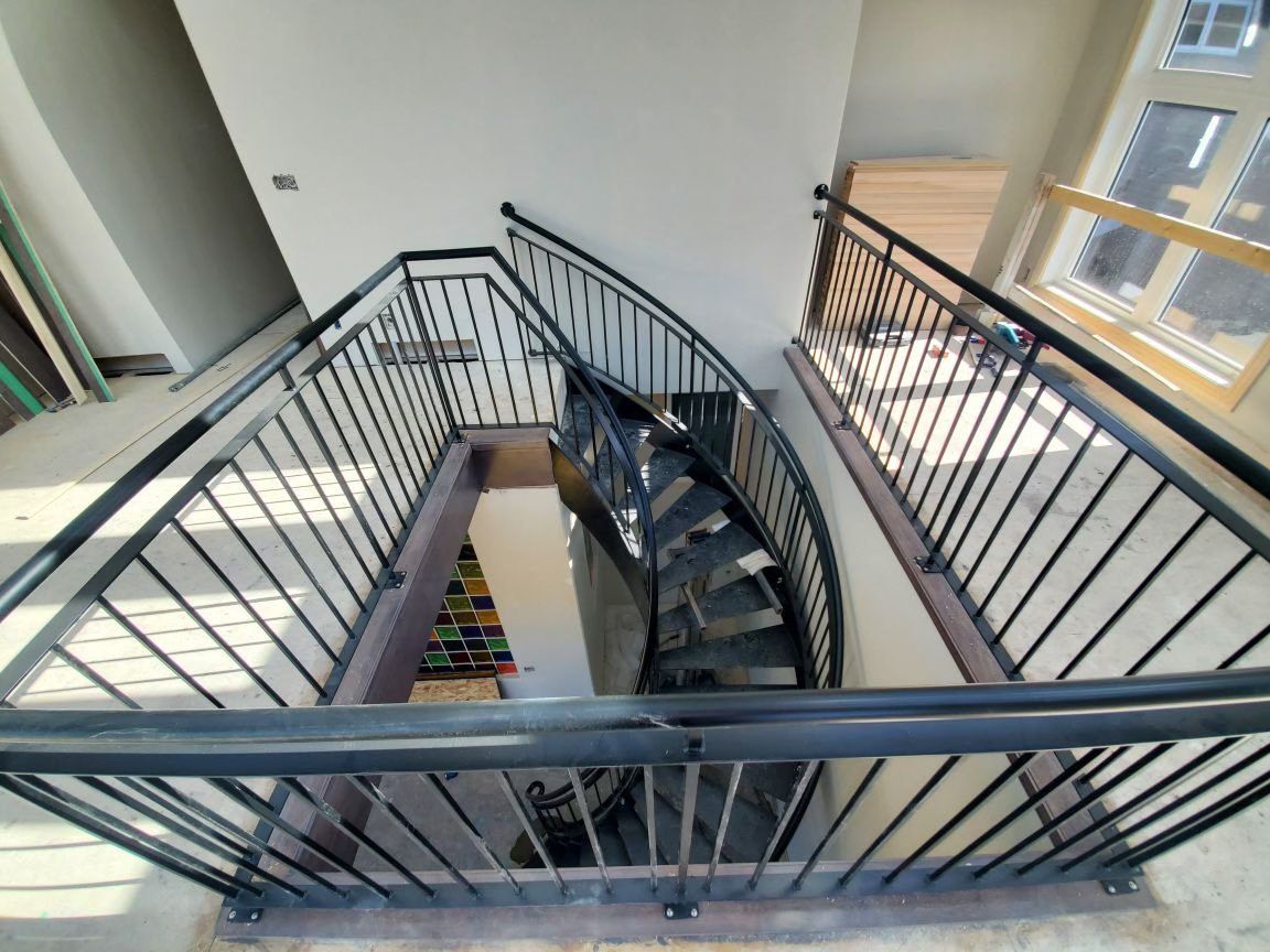 LarkaunHomes's tweet photo. We finally got these curved steel stairs into place. How amazing does this look. #larkaunrenovations https://t.co/t9bSYYVvQ8