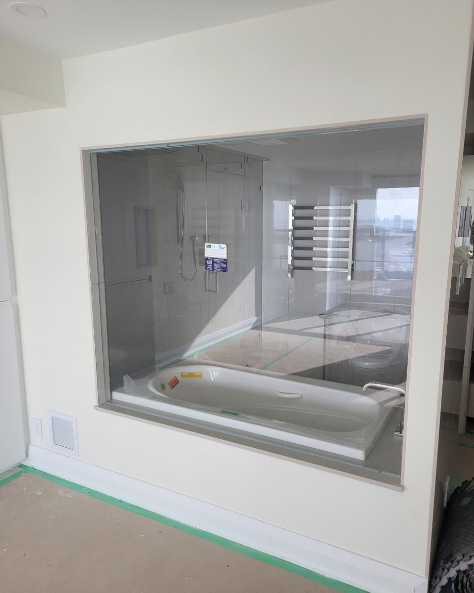 DoorsandMore's tweet image. A panel of custom low iron glass was installed to create a window above the tub to allow the natural light in and for a view when bathing. The glass was treated with Enduro Shield to protect it against water spots. #customglass #interiorwindow #bathingwithaview