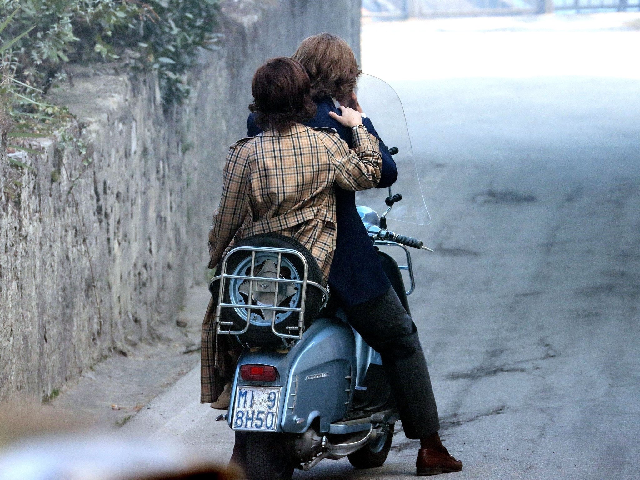 Adam Driver double-masks while rehearsing on a motorcycle on the set of  Gucci