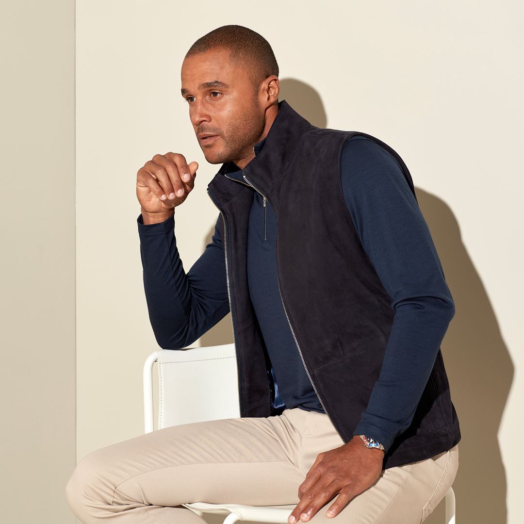 Our handcrafted vest is both smart and sporty. Shown in our navy suede fabric, it's lined with insulating tech to keep in the warmth. Wear it over one of our shirts, zip-neck sweaters, or knits.