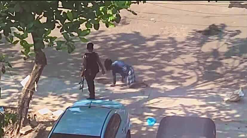 Military Junta terrorist are abusing on human dignity by letting him crawl on the road. He kicked him &amp; forced him to carry the sand bags in Kyouk Myaung,Tamwe.  #whatshappeninginmyanmar #Mar19Coup