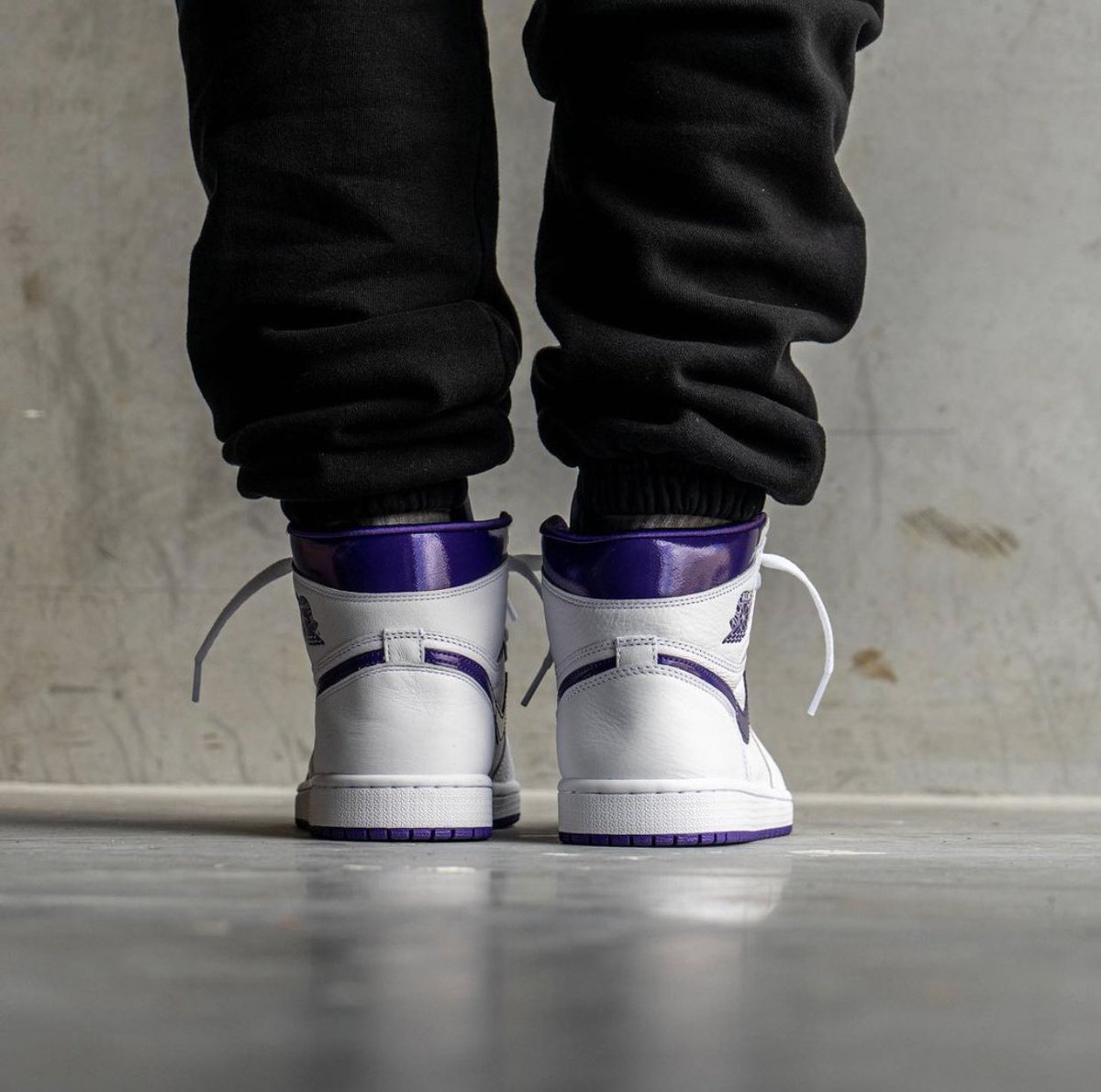 metallic purple jordan 1 on feet