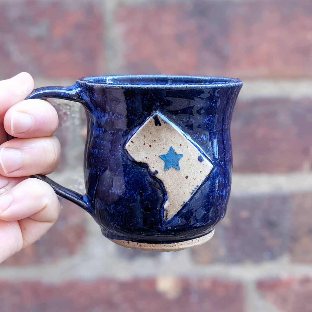 claylacepottery's tweet photo. Good morning! I haven't posted a #mug for #MarchMugMadness in a bit, here's one of my #DCMap #mugs. Let's make DC the #51ststate! #DCstatehood
#wearedc #bluemug #mugshotmonday #blueglaze #coffeemug #morningcoffee #caffeinefix #acreativedc #mydccool #madeindc #bythings #handmade https://t.co/lNLCTsFjZh