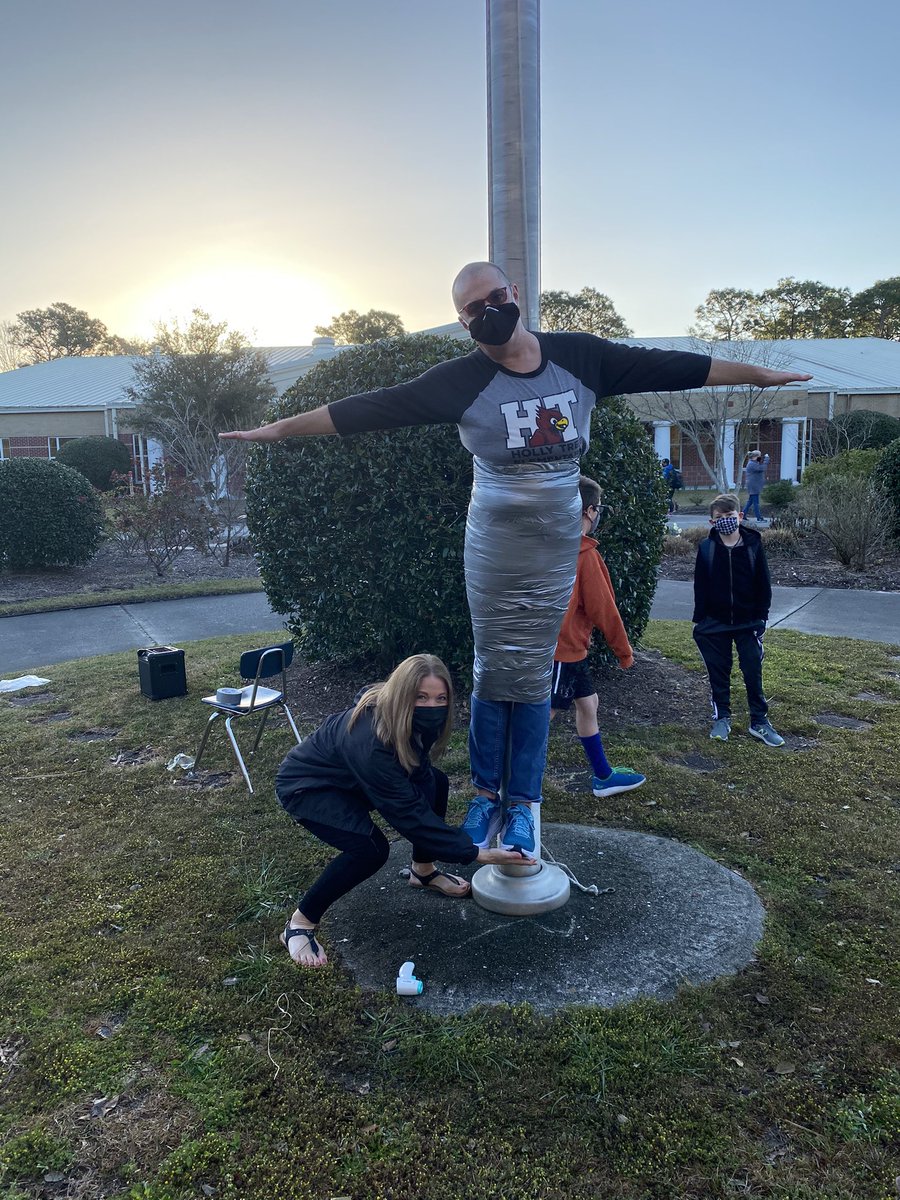 In celebration of exceeding our goal during our Boosterthon event, Mr. Moore was duct taped to the flagpole during drop off.  What a fun way to kick off fabulous Friday of learning!  <a href="/NewHanoverCoSch/">New Hanover County Schools</a> <a href="/foustc/">Charles Foust, Ed.D</a> #NHCSLeadingTheWay #NHCSchat