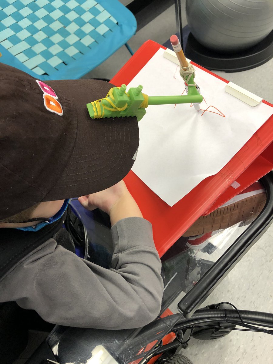 rachelthirosot's tweet photo. This kiddo is such a hard worker. He put up with lots of tweaks while @SeidlSTEAMspace printed shared files from @MakerMakeChange and @carly_lutz found the best hat ever for headstick marker access. #pediatricOT #AssistiveTechnology #ATP #headcontrol #headstick https://t.co/X6CST56Too
