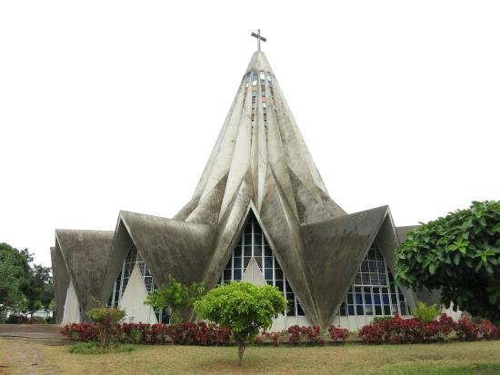 We're visiting Saint Anthony Catholic Church in Maputo today. It was originally built in 1962 & was restored in 1992 and has the shape of an inverted flower. There are crystal windows in the dome that allow colorful light to shine into the church.