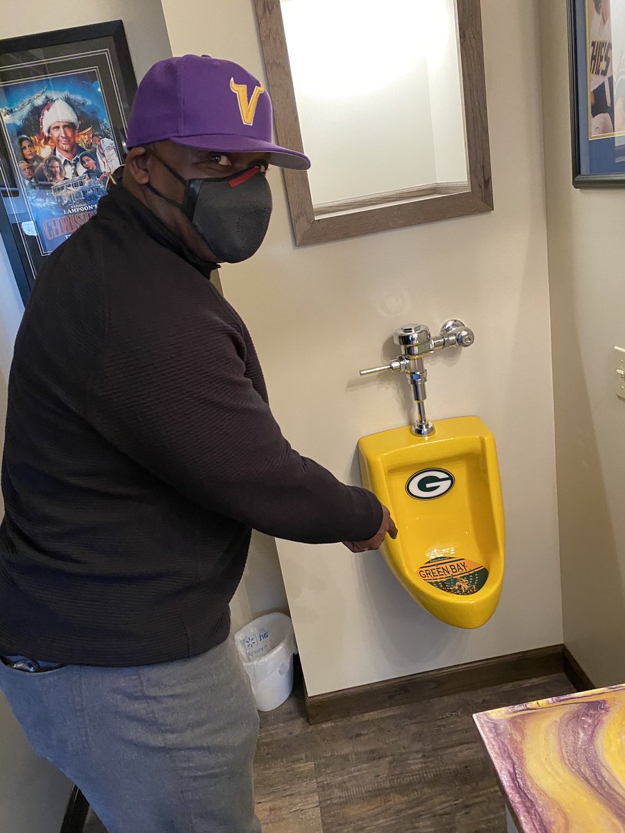 Kramer9Tommy's tweet photo. Big dog is in the house! John Randle using my Packer urinal. https://t.co/02huZthc8k