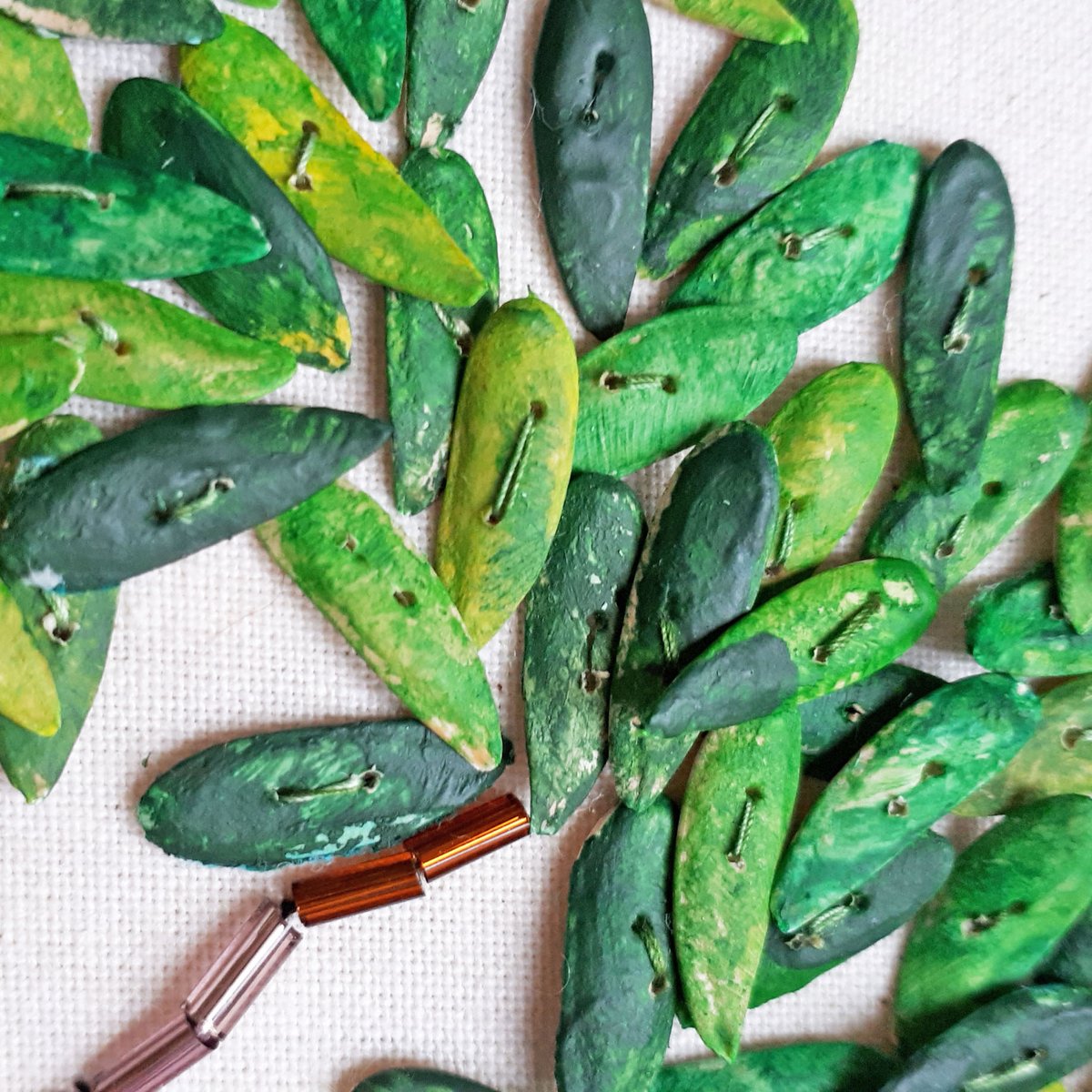 Hippystitch's tweet photo. Who remembers painting melon seeds as a child - usually to make a necklace or bracelet?  I did.  Have been doing some of that lately for a different purpose...
https://t.co/DPVzuUkY9A
#embroidery #embellishment #melonseeds #naturalsequins #stitching #trees #stitchedtrees https://t.co/NbR1JmSBpY