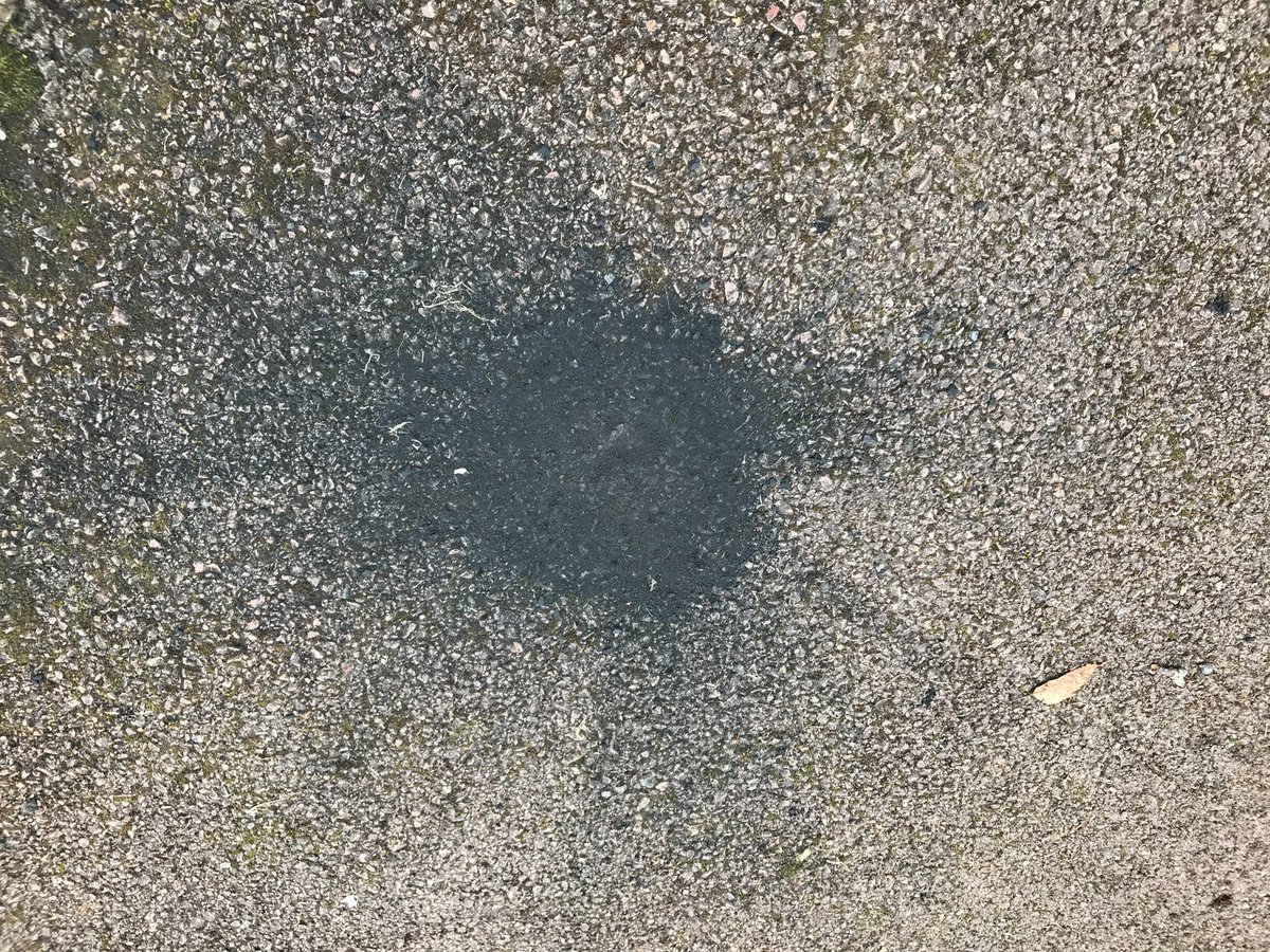 OU_SPS's tweet photo. Ever wondered what a meteorite fall would look like on a driveway? 

The main mass of rock has been recovered here (the 2nd photo shows a small dent where the rock sat) but the black sooty mark is meteoritic dust produced when the space rock impacted the ground 
#UKmeteorite https://t.co/4Z7alLKwQN