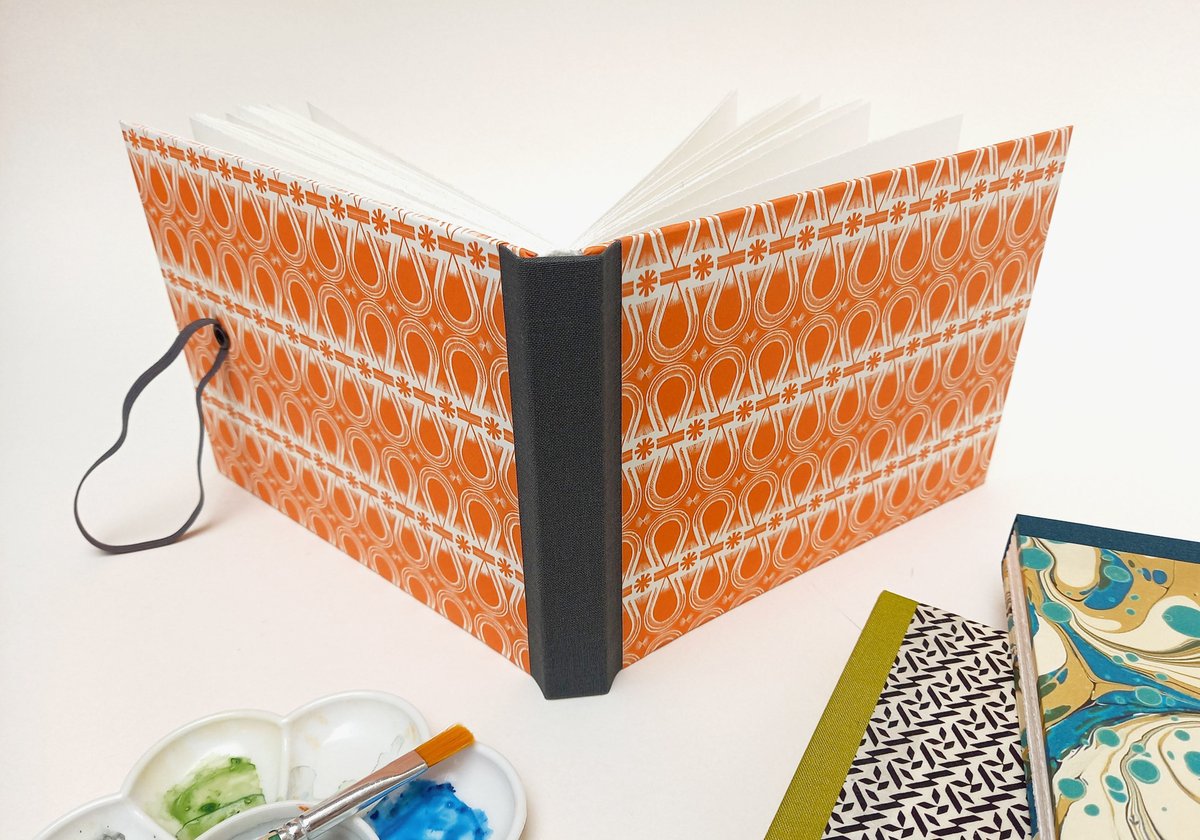 New Watercolour Sketchbooks - a smidge under A5 size, hardcover and lay flat for ease of use. Just this orange one in stock for now, the others are spoken for already: etsy.me/3emFxmN #sketchbook # watercolourart #artsupplies #artistgift #handmadesketchbook #bookbinding