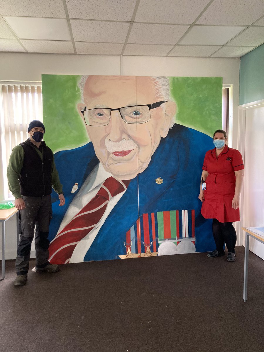 Wow! Today our <a href="/RCHTWeCare/">Royal Cornwall Hospitals NHS Trust</a> vaccination centre at Wadebridge received the donation of this amazing artwork! What an incredible tribute to <a href="/SirTomMoore1/">( Sir ) CaptainTomMoore</a> - artist Jonny Guyett pictured from Camborne town council <a href="/PharmacistIT/">Iain Davidson</a> <a href="/KerryEldridge1/">Kerry Eldridge</a> <a href="/RCHTCE/">Kate Shields</a> @nurse_hollym <a href="/helenwinn55/">Helen Winn</a>