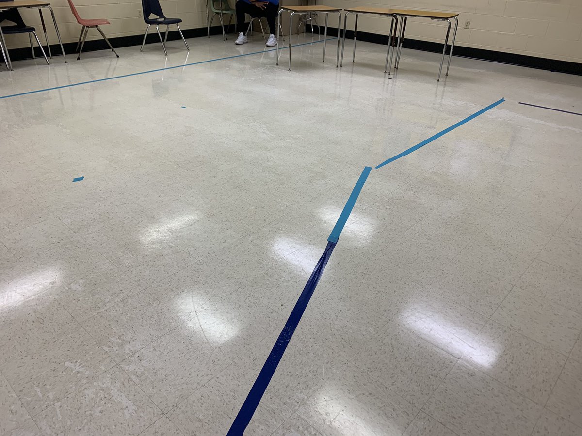 Architecture students from Clark Hall use duct tape in the empty speech room to map out the dimensions of the future Lincoln Live news set being built in the studio. It’s 27 feet long. 17+wide. News desk. Interview area. Green screen. Four monitors. We’re not messin’ around!