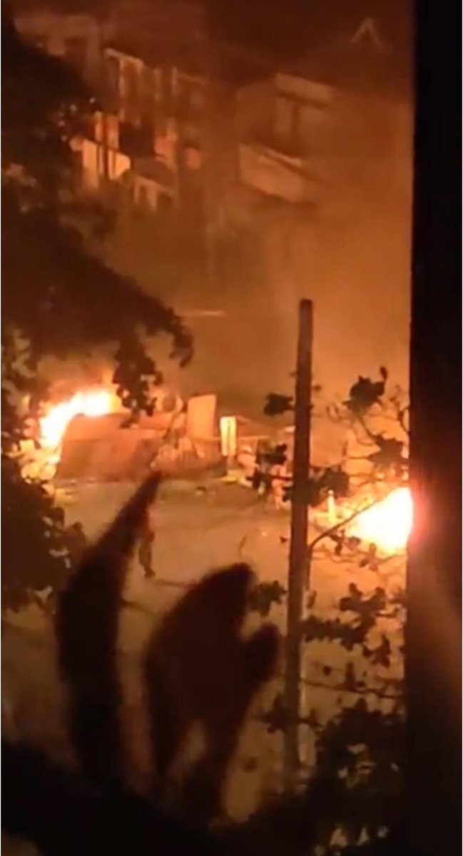 TinSandarZaw1's tweet photo. In #Thingyankyun, #Yangon, Pagoda road, Terrorists set fire and make the fire spread to the citizen's buildings at 10:23PM. Locals say they even heard the sounds of breaking bottles also and one man got hurt by the shot. 
#WhatsHappeninglnMyanmar #Mar9Coup https://t.co/BfTEESUYBr