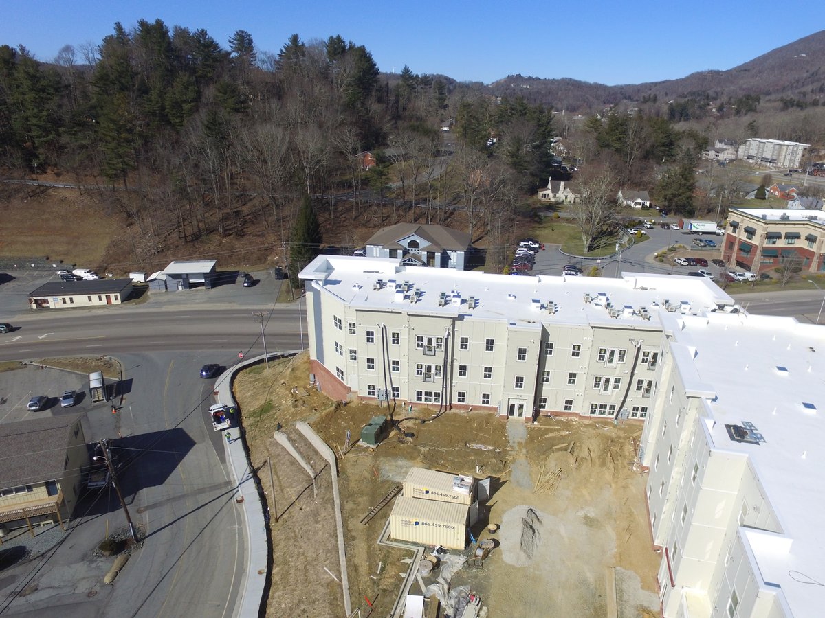 DavieConstNC's tweet photo. We love drone shots! Here's Project Peak, a mixed-use retail &amp; student housing project in Boone NC that features amenities like enclosed parking, storage units &amp; rooftop deck w/gorgeous mountain views! #projectpeak #appstate #studenthousing #mixeduseconstruction #daviedelivers https://t.co/8coWNMuO2l