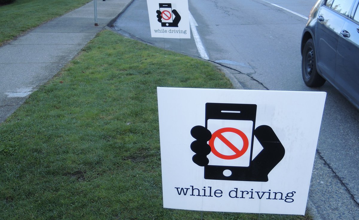 SurreyRCMP's tweet image. See these signs? It means our officers and #CellWatch volunteers are nearby checking for distracted drivers. @icbc @PreventCrimes #VisionZeroSurrey #LeaveYourPhoneAlone