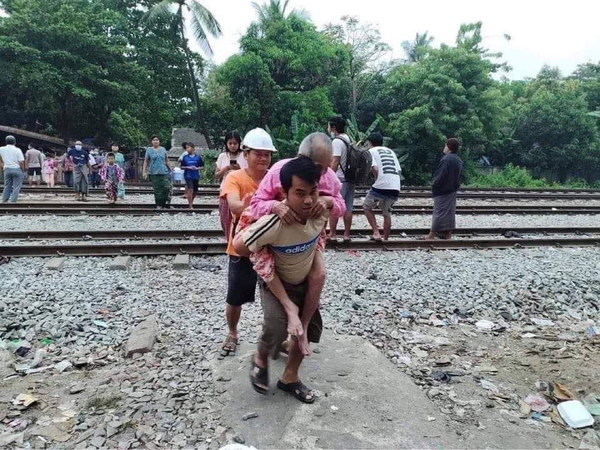 Family members move safe place  during the polices and military raid  a dormitory of Myanmar railway staffs in Yangon on Wednesday morning. #WhatsHappeningInMyanmar