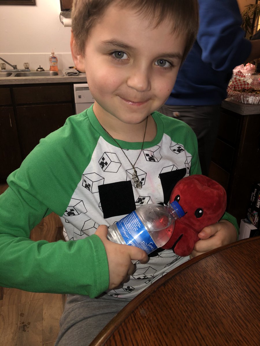 my baby brother is excited for sissy to be induced tomorrow! he was pretending to feed a bottle to his octopus plushy 💗 wearing his quartz pendant from @innrsoul he is obsessed with it! 🤩