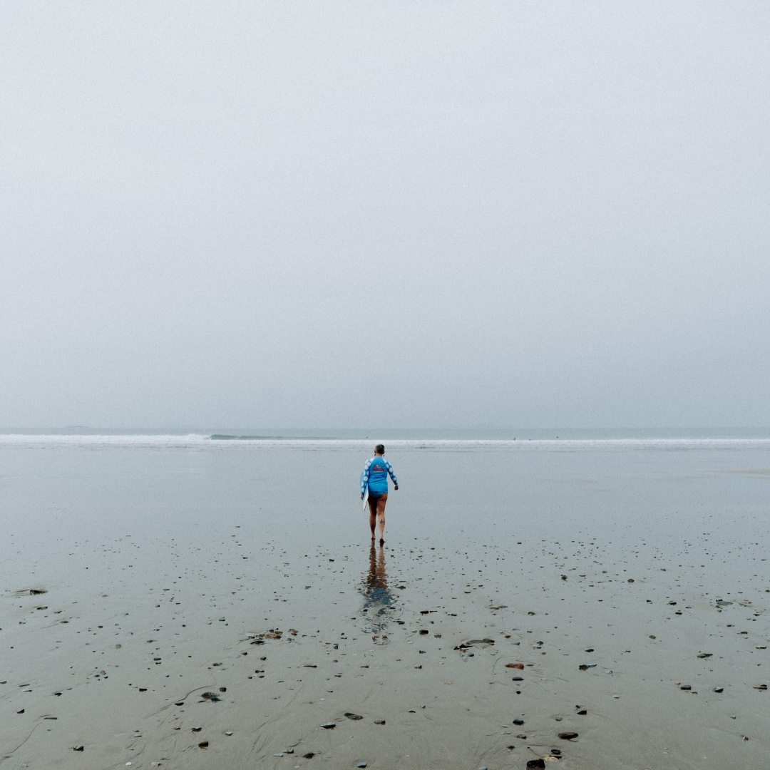 🌊☁️ Grey misty swims on an empty beach make our souls sing! What's your favourite weather to dip in?