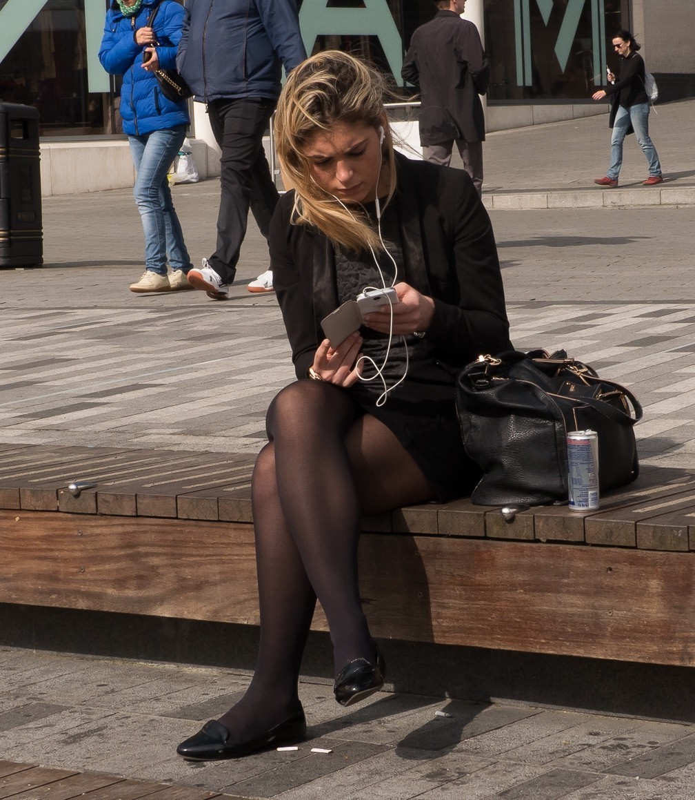 “Checking out her phone with her legs crossed in opaque #pantyhose” .