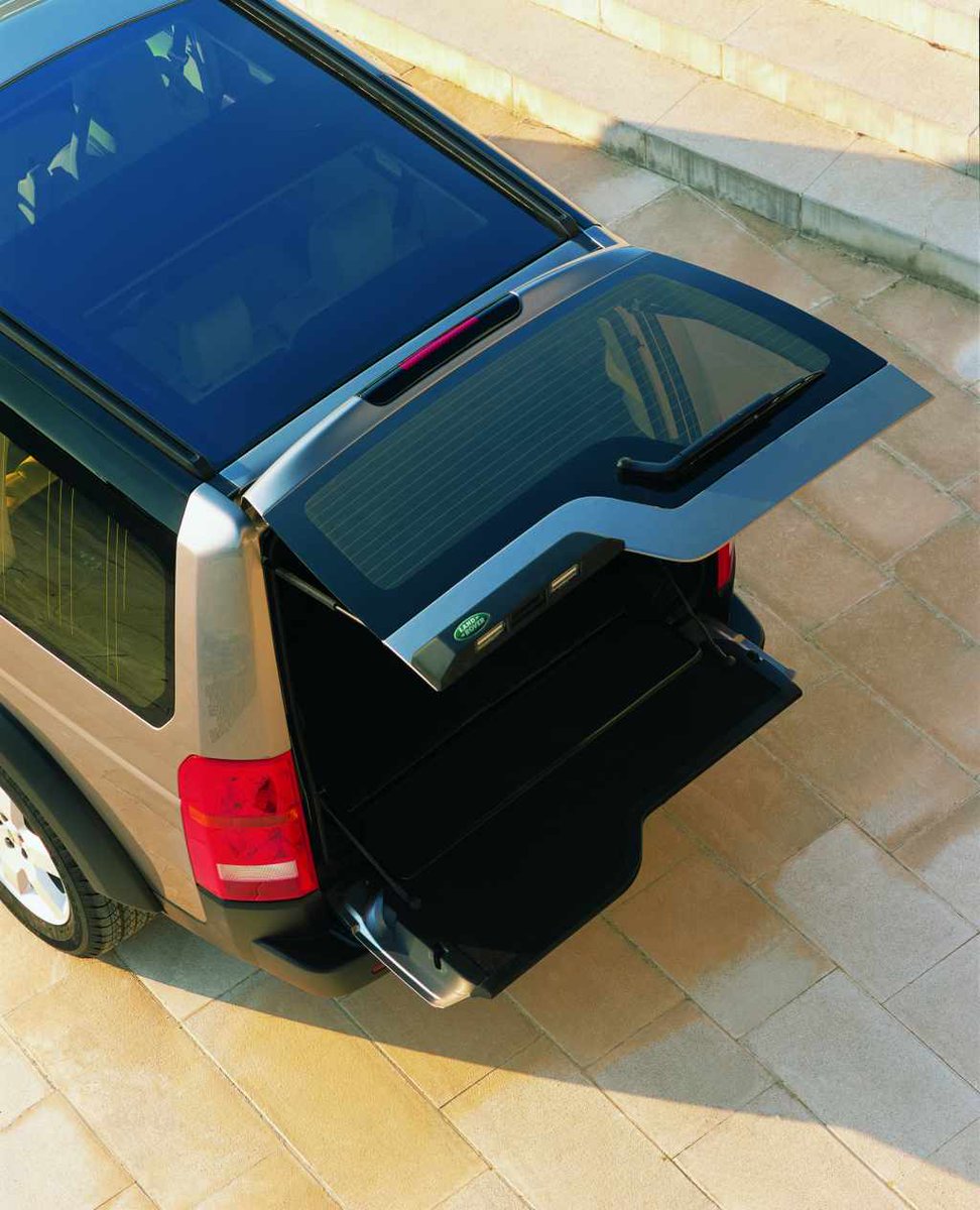 Land Rover Discovery 3 with upper and lower tailgate open, viewed from above.