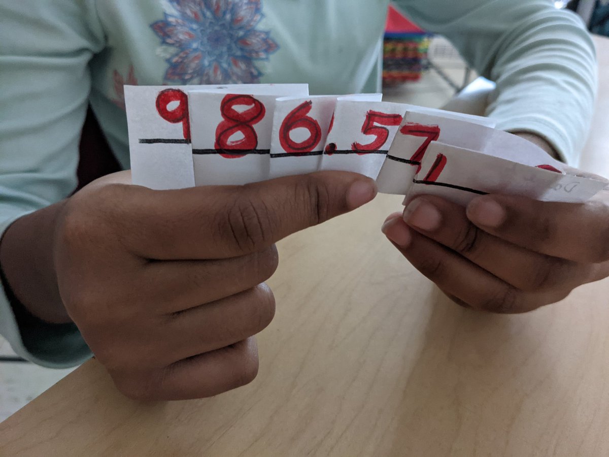 HrceJennifer's tweet photo. Students enjoyed making and using these place value strips in 5/6 Dewolfe! They helped consolidate our understanding of place value and were a useful tool when writing different expressions for a decimal number. @JoeHoweSchool @DewolfTerin @dr_costello #HRCEmath #elemmathchat https://t.co/HDW0zfU6Ec