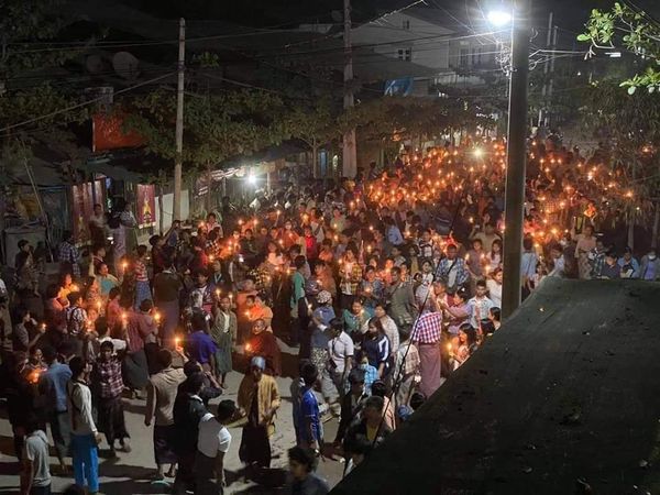 Defying a curfew in Myanmar, protesters gather with candles in the town of Myingyan #WhatsHappeningInMyanmar pic: Mizzima