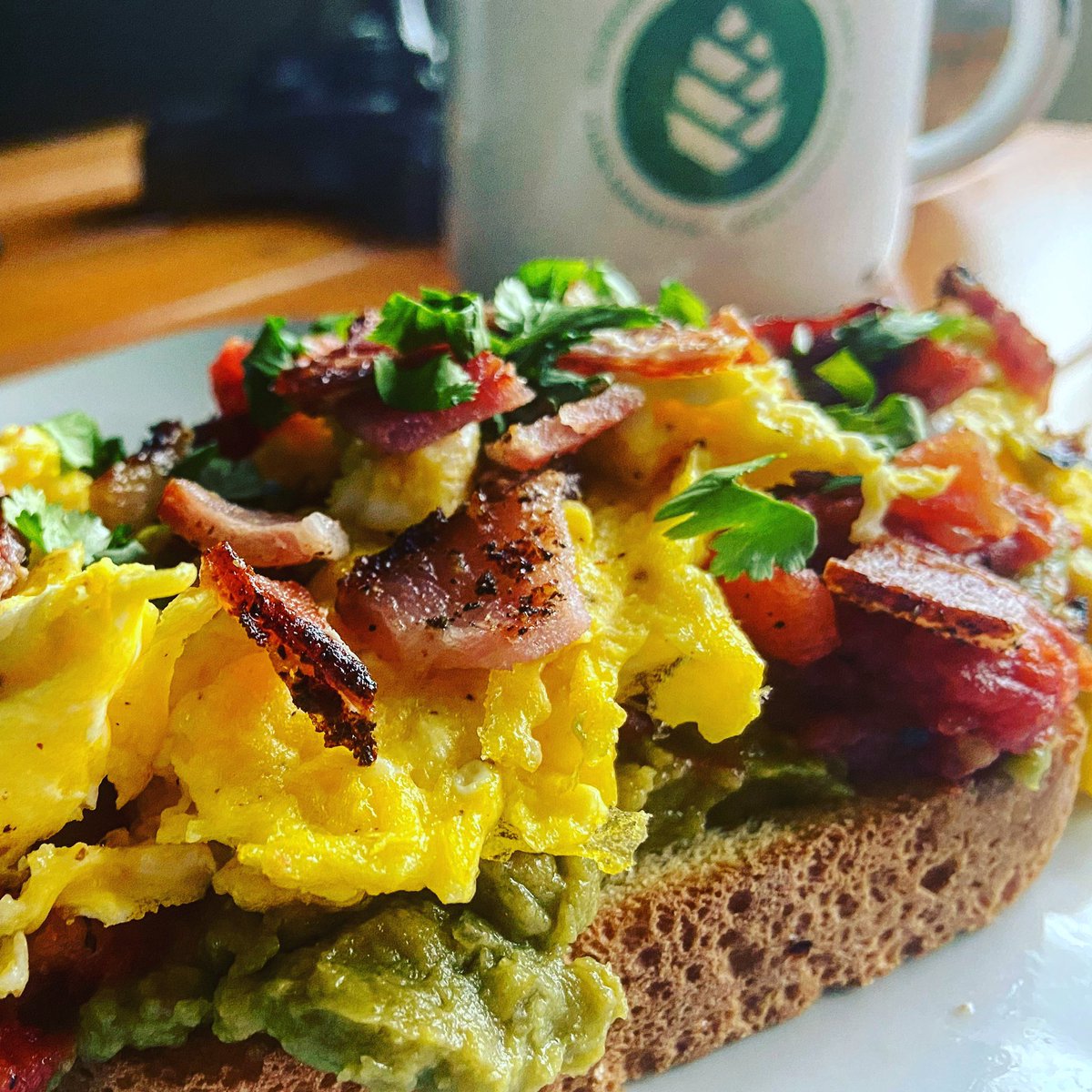 Inthewoods2014's tweet photo. Bacon Avocado Toast with roasted tomatoes and more bacon... (keeping it healthy) Oh and some scrambles.  #nom #usewhatyagot https://t.co/j8sYURsjl5
