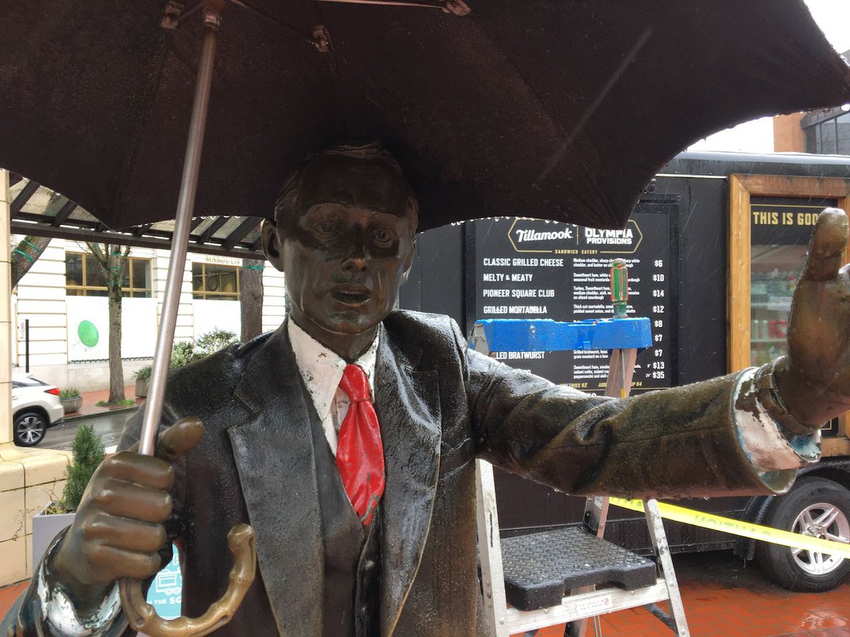 Oregonian's tweet photo. Downtown Portland’s ‘Umbrella Man’ gets his umbrella back, newly spruced up after vandalism last fall https://t.co/jDxa3fR5vz https://t.co/0P0rU9udXq