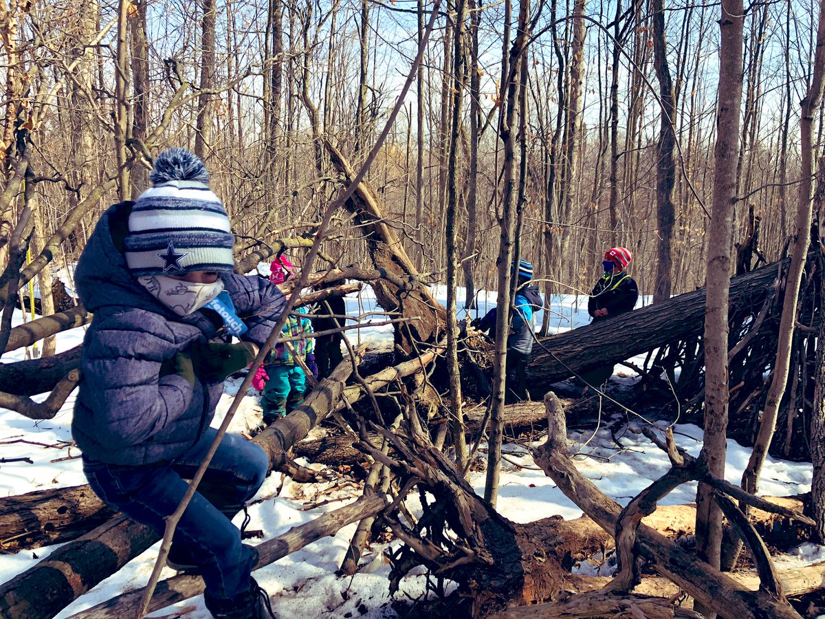 MsRumsby's tweet photo. Deep in the forest you will find a kindergarten class learning through play with the natural environment and with the shelter they made! And educators who watch the learning unfold! #FDK #noworksheetshere #raisingstudentstocarefortheenvironment #naturesplayground @StortoK2 https://t.co/3XgNILbQbQ