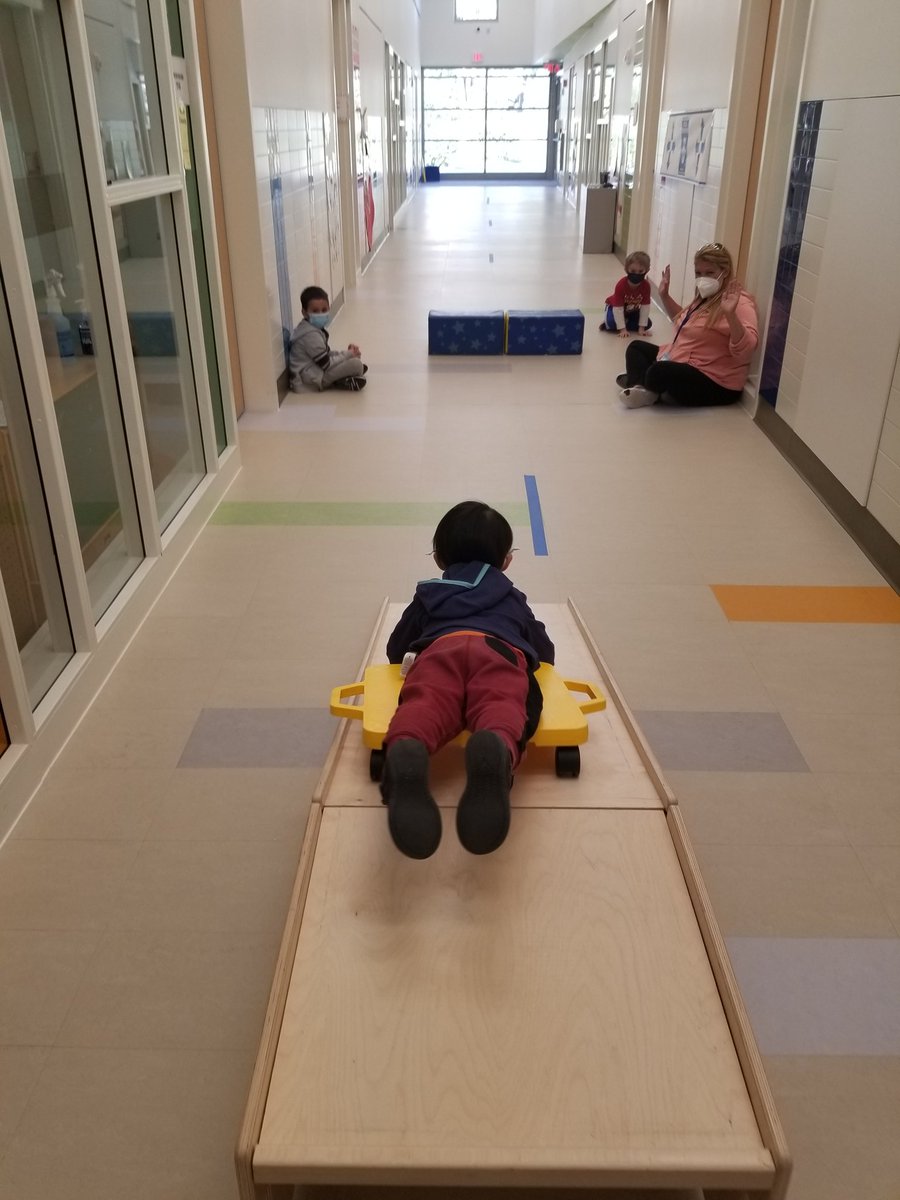 While my preschool virtual motor groups have been successful,  I've really been missing the connections I have with the classes.  This week I was able to take small groups in the hall for a fun scooter board activity.  Their giggles kept me smiling all day! #schoolbasedpt #lcp