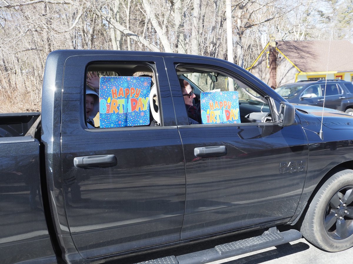 George Barber and his daughter, Cathy Jenks, wave at local police and fire department members and their family in the motorcade celebrating the World War II combat veteran's 95th birthday outside Berard-Desjarlais Post 88 of the American Legion on Chapel Street on Sunday.