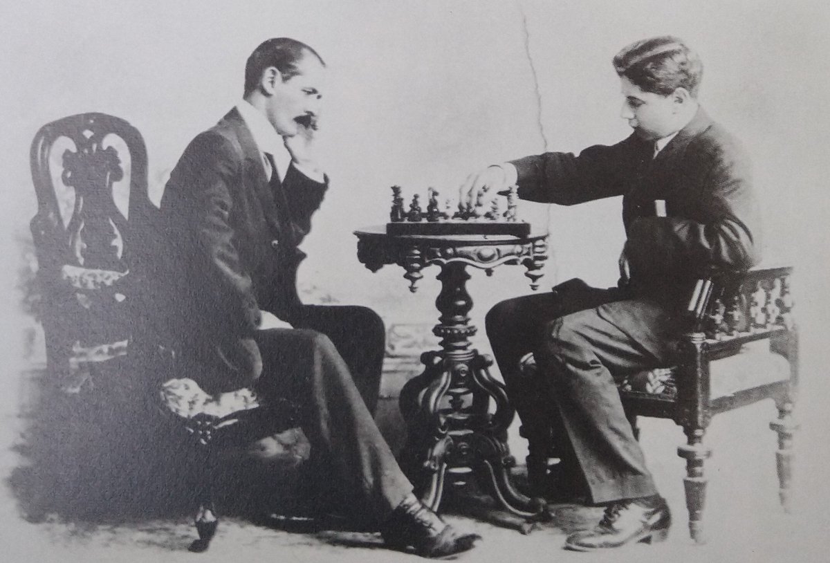 Capablanca playing his father, at 4 1/2 in 1892 and at 21 in 1909. Chess set and table are the same. After 17 years,  Capa sits now in papi's chair. Father seems equally puzzled in both pictures!