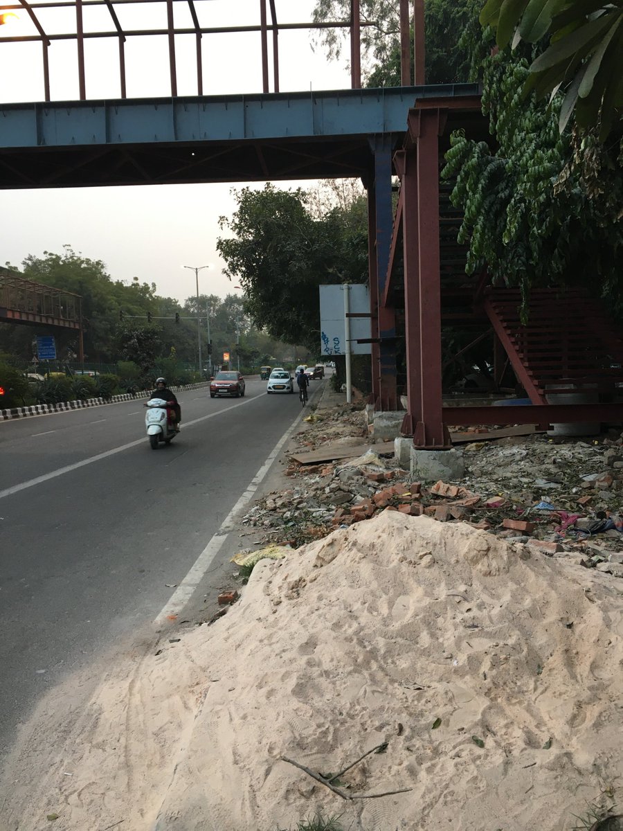 malba_project's tweet photo. The #waste from the construction of a foot-over bridge in #GreenPark #NewDelhi, made to ease pedestrian movement, leaves the footpath unusable. #irony #punintended https://t.co/k1cPRf53nS