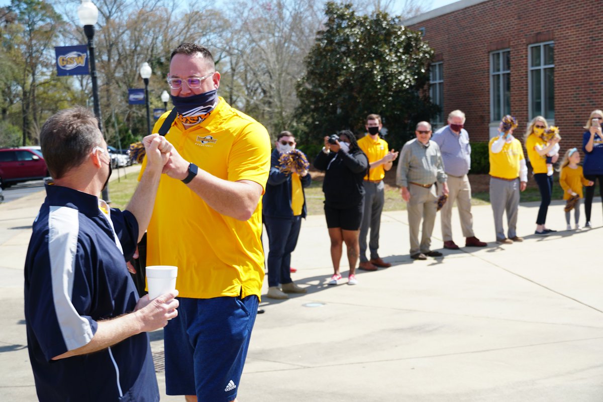 GSWAthletics's tweet photo. And with that, @GSW_MBASKETBALL is off to Valdosta for the NCAA Division II South Regional Quarterfinals of the Men's Basketball Championship!
The #GoldForce will definitely help fuel this trip. 💛✊ Thanks to those who could make it this morning for the send-off. https://t.co/4YbQCG6m27