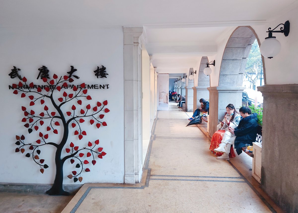 shanghaidaily's tweet photo. The historic Normandie Apartments, also known as #Wukang Mansion, in #Shanghai's downtown #Xuhui District has recently finished another function upgrade with an organized layout of photography point, cafe, bookstore and cultural space on its ground floor. https://t.co/nsfbuQLmHC
