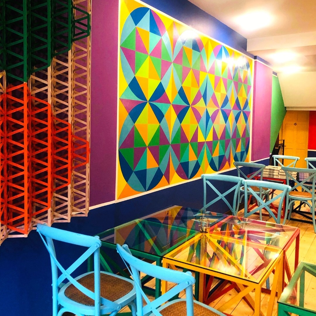 Diners at Shamiyaana can expect to be immersed in Araeen’s colourful, geometric, and dynamic artworks – paintings, wall sculptures and glass-topped cubes which make up the tables, all lit up as if in a gallery. Read more: linkedin.com/posts/shamiyaa…