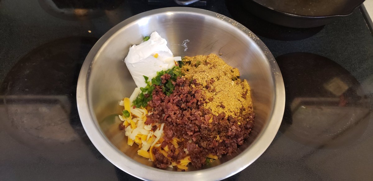 EvolutionPrime's tweet image. #BaconExplosion just getting started.  Filling of cream cheese, Mexican blend cheese, jalapeños, pound of bacon, and spices.