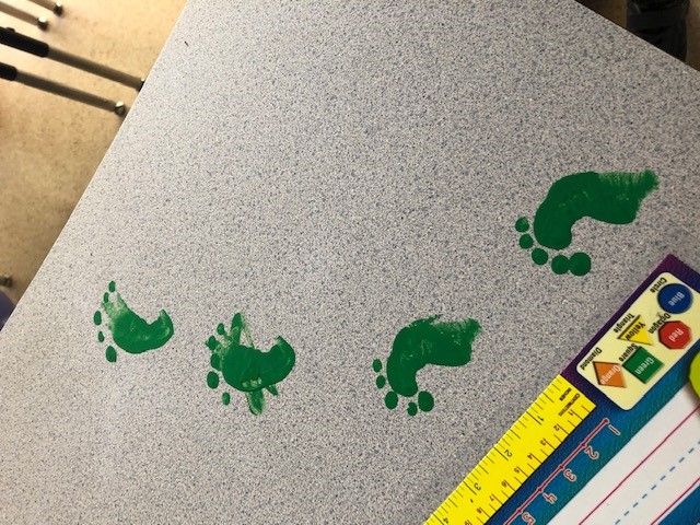 Sd36Prince's tweet photo. Div 10 had a visit from the Green Leprechaun who came by before St. Patrick's Day.☘️Students tried to trap the trickster but they were outsmarted! The ingenious handmade traps were empty but gold coins &amp; little green footprints were left for perplexed 6 yr old's! @Surrey_Schools https://t.co/bpcxYTrN9T