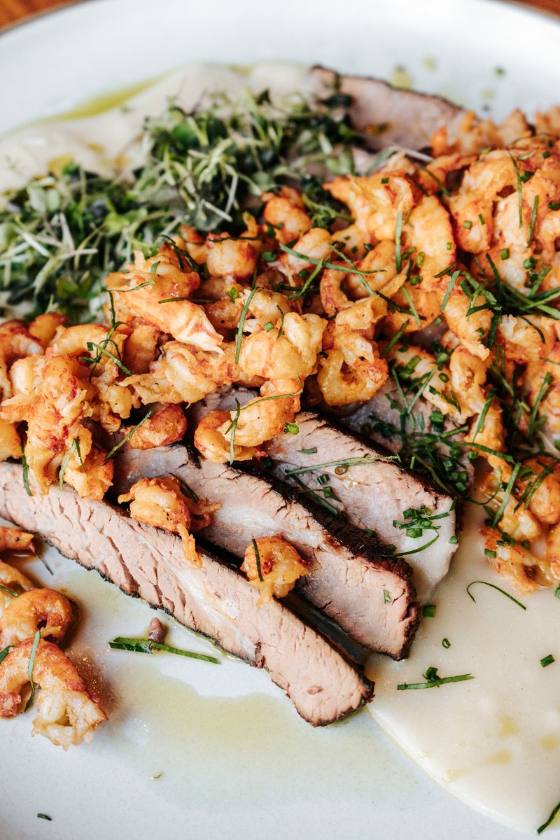 Surf &amp; turf is always a delicious choice! Try our dry aged tri-tip &amp; crawfish with a mixed herb salad, fried chilies, “thermidor” sauce 💯💯