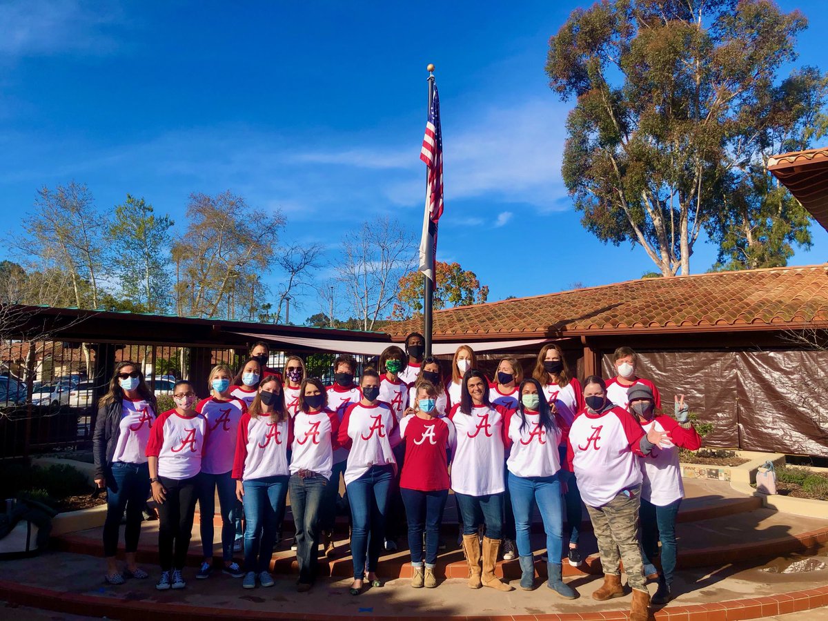 So sweet!  My little sister Alison (in front, without a mask) on her last day teaching at Rhoades Elementary School in Encinitas before starting chemo next week to beat breast cancer.  Her coworkers surprised her by donning Bama gear &amp; singing “Sweet Home Alabama”.
