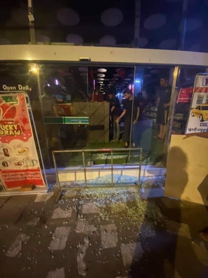 WinBoBo7's tweet photo. Last night, 12th March 2021, a change of mini mart, One Sop, glass windows were broken by military and police. But the people from neighborhood protected the mart from lootings for the mart. https://t.co/PBE3bGmlOF