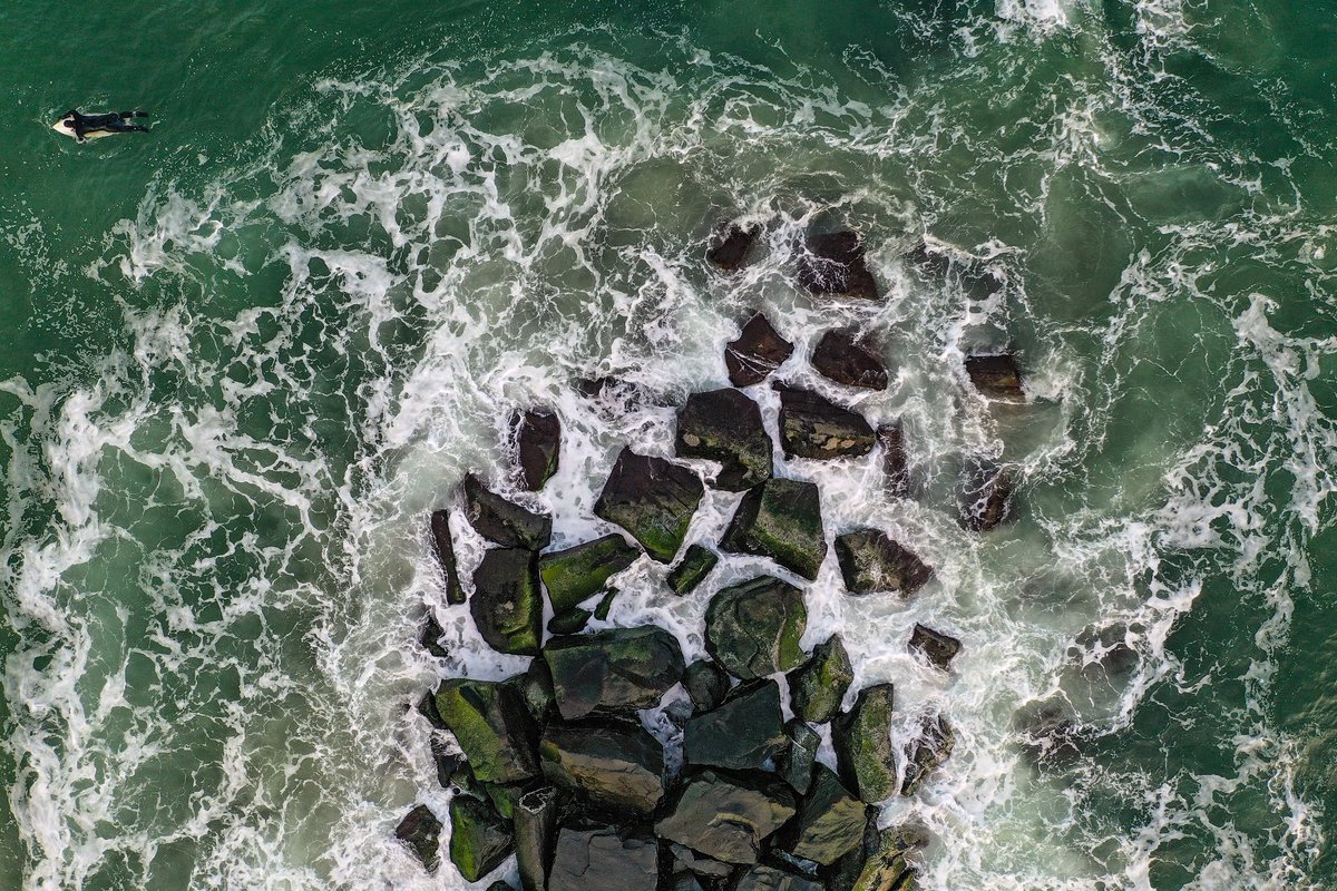 Water temperatures in the Atlantic are slowly rising from the winter months - but the frigid ocean has never stopped surfers from chasing waves // @GettySport