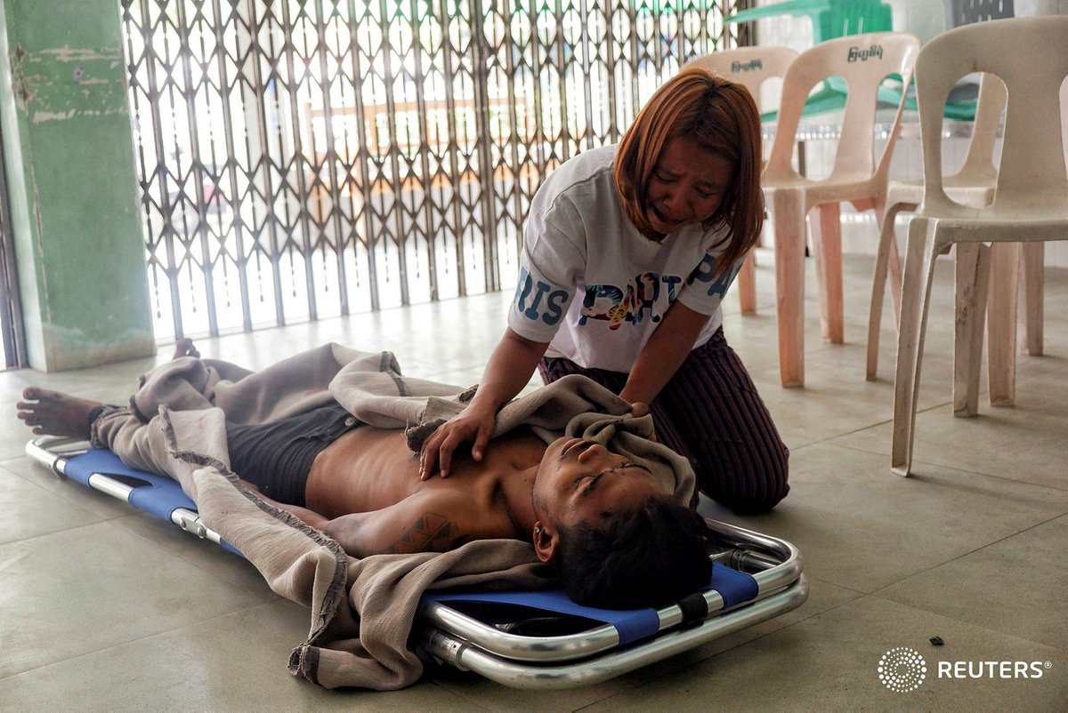A family member cries near dead body of Saw Pyae Naing, 21, who was shot and killed during the protests against the military coup in Mandalay, Myanmar, March 13, 2021. REUTERS #WhatsHappeningInMyanmar