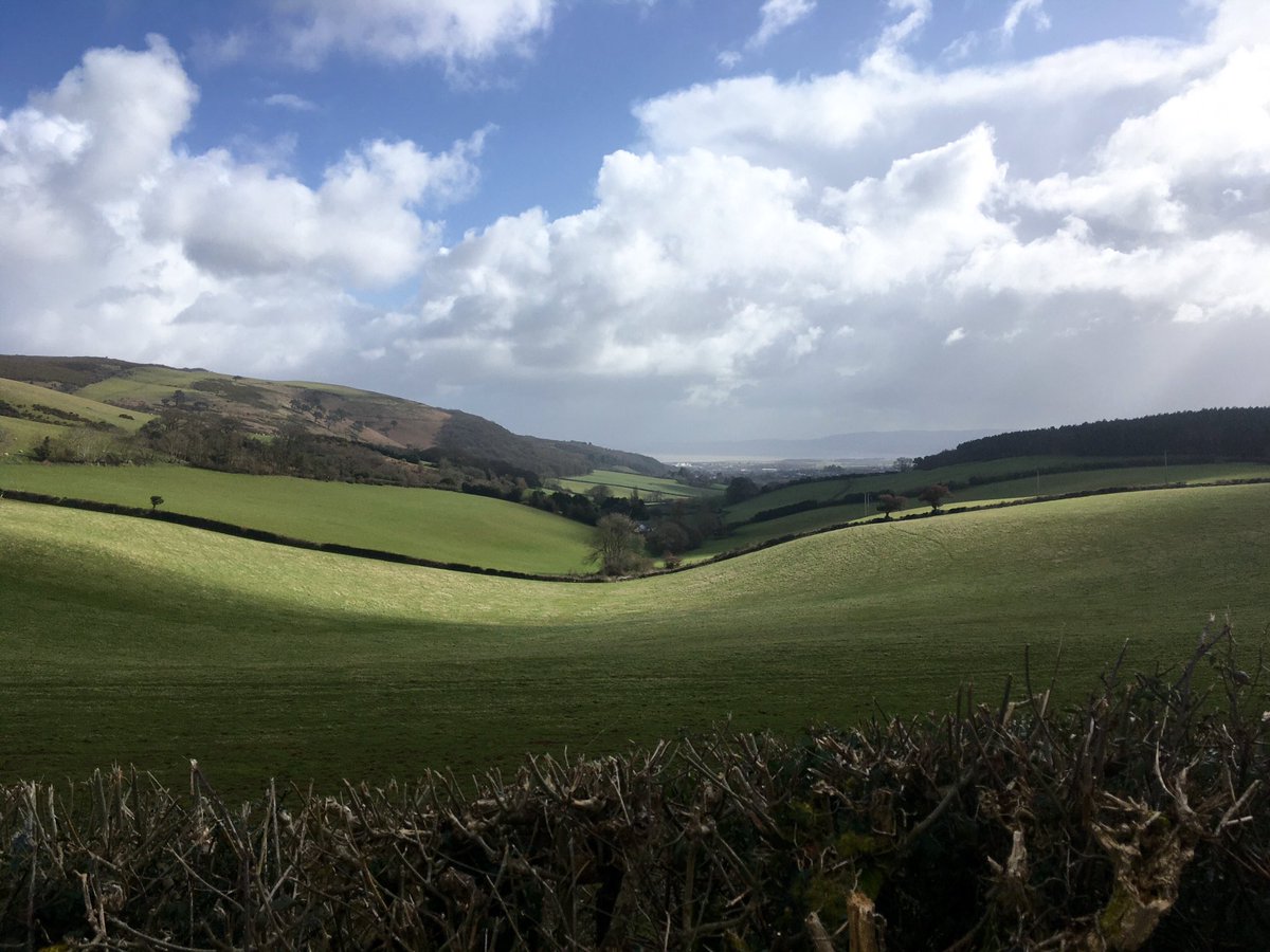 ExmoorNPCs's tweet image. Dean's Lane looking towards #Minehead and a rain swept #Quantocks. #Exmoor